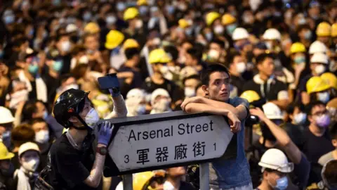 HECTOR RETAMAL/AFP/Getty Images Thousands of protesters converged on Hong Kong's police headquarters on 21 June