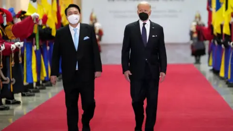 Getty Images U.S. President Joe Biden and South Korean President Yoon Suk-yeol arrive at the National Museum of Korea for the state dinner, on May 21, 2022 in Seoul, South Korea.