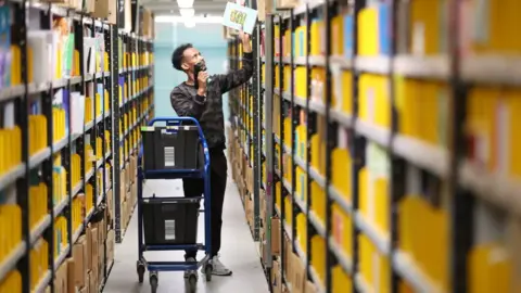 Getty Images Amazon worker in distribution centre