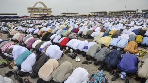 AFP People pray during the celebration of the Eid al-Fitr at Independence Square in Accra, Ghana - June 2017
