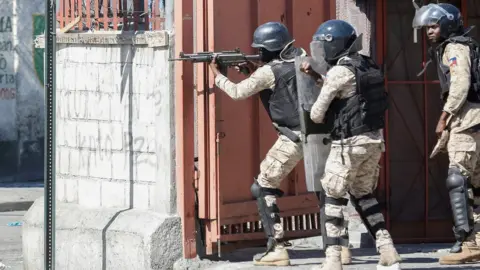 Reuters Armed police in Port au Prince, Haiti, on 7 February 2021