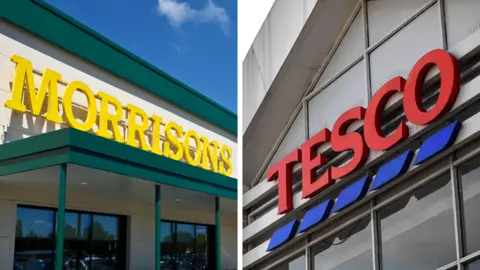 AFP/UIG via Getty Images Morrisons and Tesco signage