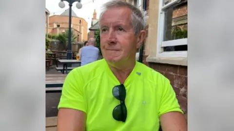 Avon and Somerset Police A man in hi vis yellow vest