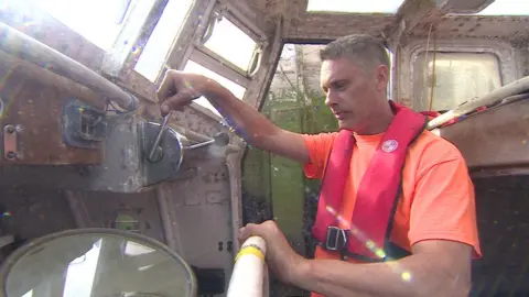 Richard Sworder inside the lifeboat