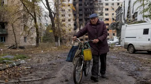 Reuters A man walks in Avdiivka