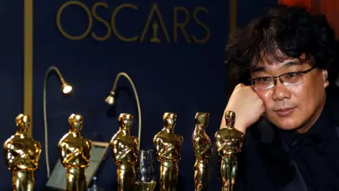 Reuters Bong Joon-ho with his Oscars