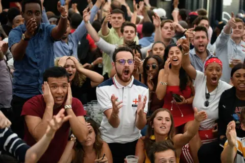 Getty Images Fans celebrate England victory at Boxpark, London