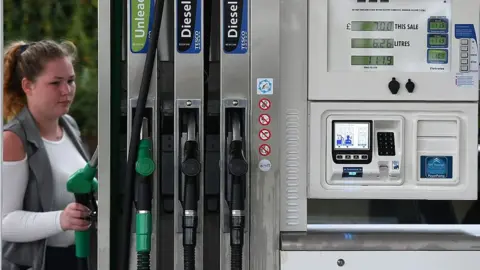 Getty Images Woman at petrol station