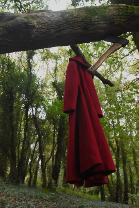 Amanda Lake Red cape and an axe