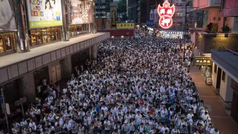 EPA Thousands of protesters take part in a march against amendments to an extradition bill in Hong Kong