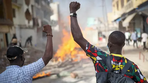 Getty Images Protesters barricade a street in about the postponement of the presidential election in Dakar, Senegal - 9 February 2024
