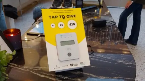 Safer Cornwall A 'Tap for Penzance' machine in a shop