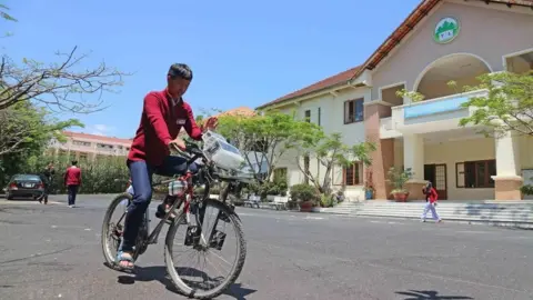 Viet Nam News/Nguyen Dung A student riding a bike