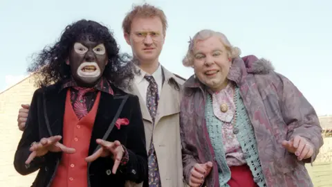 The League of Gentlemen with Reece Shearsmith as Papa Lazarou (left)