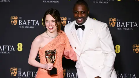 Getty Images Emma Stone and Idris Elba