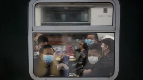 Getty Images Train operation while the train from Xi'an to Guangzhou stops in Wuhan on April 8,2020 in Wuhan, Hubei Province, China. The Chinese government lifted travel restrictions from April 8, after almost 11 weeks of lockdown to stem the spread of COVID-19