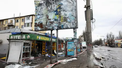 Reuters A bus stop damaged after a shelling, amid Russia's attack on Ukraine, in Kherson, Ukraine February 21, 2023