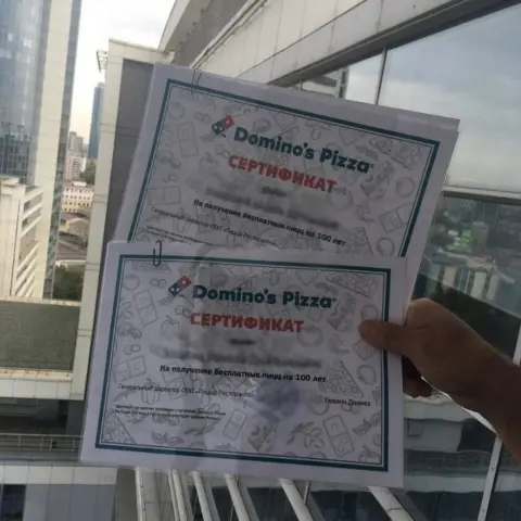 @detskie_fotki Two certificates in Russian with the Domino's Pizza logo