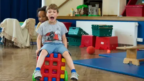 Panash Shah Two children play at Cambridge Kids Club