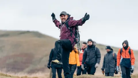 Muslim Hikers A man on a hike posing for a picture