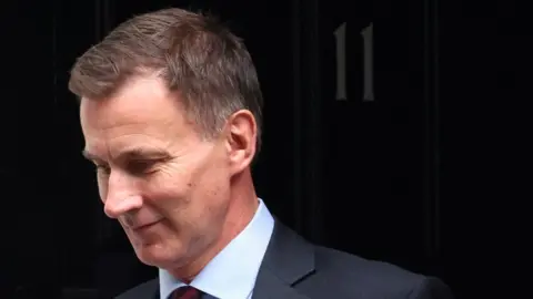 TOBY MELVILLE British Chancellor of the Exchequer Jeremy Hunt leaves Downing Street in London.