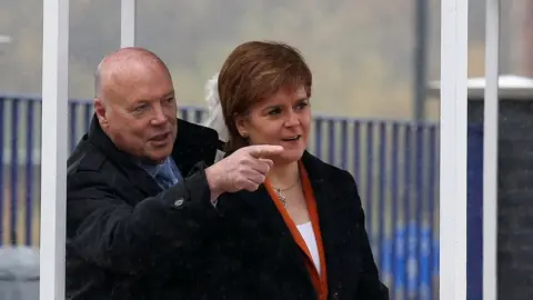 PA Media Jim McColl and Nicola Sturgeon
