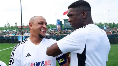 Getty Images Roberto Carlos and Clarence Seedorf