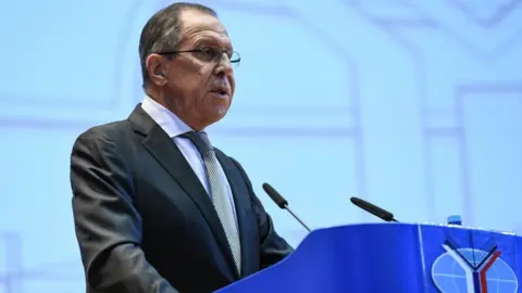 AFP Sergei Lavrov at a podium talking