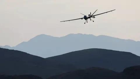 Getty Images A US drone over the desert in Nevada