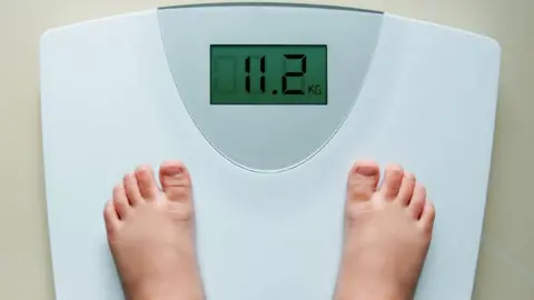 Getty Images child on scales