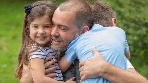 West Midlands Police PSCO William Till with his family