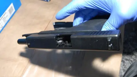 CPS A recovered gun on its side