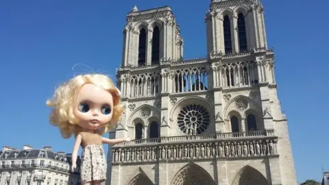 Laura Kate Shippert Blythe doll in front of Notre Dame