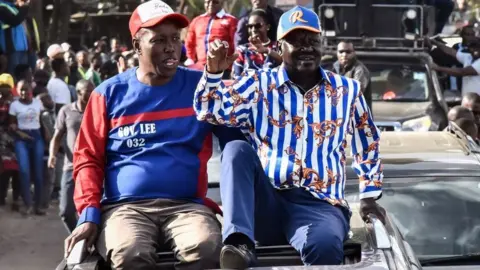 Getty Images Azimio coalition party's Raila Odinga (R) reacts to supporters with Nakuru county Governor Lee Kinyanjui (L) during his rally after being officially nominated as a Presidential candidate by Independent Electoral and Boundaries Commission (IEBC) in Nakuru on June 5, 2022