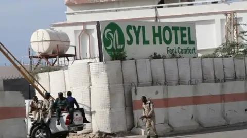 Somali government soldiers seen at the entrance of the Syl hotel in Mogadishu in 2019