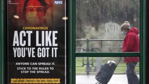 PA Media Covid sign at bus stop