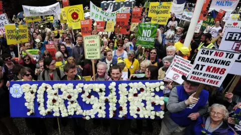 John Giles/PA Protesters outside meeting