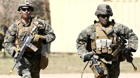 Getty Images US Marines from MRF-D (Marine Rotaional Force Darwin) participate in an Urban assault as part of Exercise 'Talisman Sabre 21' on July 27, 2021 in Townsville, Australia.