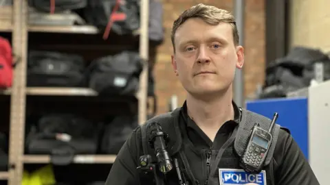 PC Peter Andrews at Huntingdon Police station at the start of the shift