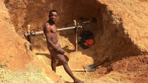 A man takes a break from work at the Barkin Ladi mine