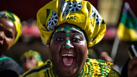 MARCO LONGARI A supporter of the ruling party Africa National Congress reacts at the Ellis Park stadium in Johannesburg, on May 5, 2019 during the final campaign rally of the party.
