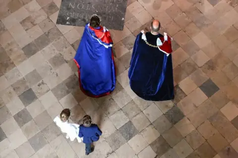 Reuters Princess Charlotte and Prince Louis entering Westminster Abbey with their parents