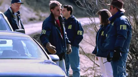 Getty Images FBI agents at the Unabomber's cabin