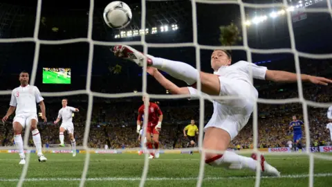 Getty Images John Terry of England clears an effort from Marko Devic of Ukraine off the line on June 19, 2012