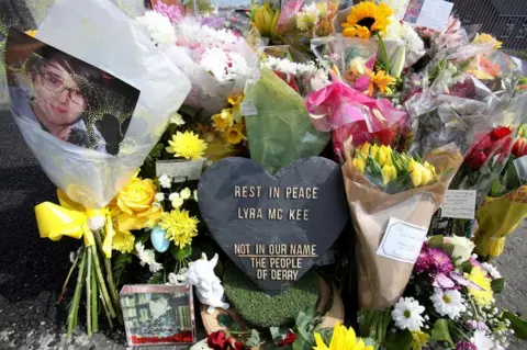 AFP Floral tributes laid at the scene where Lyra McKee was shot in Londonderry