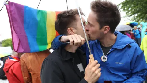 Getty Images Supporters of gay rights celebrate following a vote at the nearby Bundestag in which parliamentarians approved a new law legalising gay marriage in Germany on 30 June 2017 in Berlin