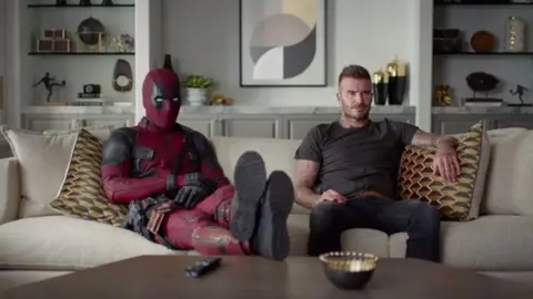 Deadpool Deadpool and David Beckham watching TV