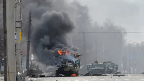 Getty Images Burning Russian vehicles in Kharkiv