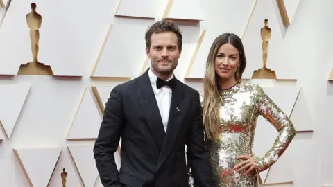 ERIC GAILLARD/REUTERS Jamie Dornan and Amelia Warner