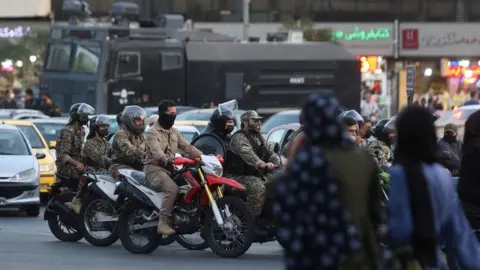 WANA via REUTERS File photo showing riot police officers riding motorcycles in Tehran, Iran (3 October 2022)